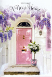 Set against the backdrop of a likely Islington townhouse, this image captures the soft thrill of a new beginning expressed entirely through flowers and gentle colour. A front door, painted a tender, dusty pink, stands in the centre, its panels simple yet elegant, glowing against surrounding whitewashed walls. To one side, a shutter painted in a similar blush hue leans slightly open, hinting at life and light within. Above and around the doorway, cascades of lavender wisteria pour down in loose, tumbling clusters, as if nature has carefully framed the entrance to celebrate whoever lives there. The wisteria's blossoms are plentiful, each tiny flower forming part of a larger trailing garland that moves with the slightest suggestion of breeze; fresh green leaves weave between the blossoms, adding contrast and depth. On the doorstep, a grey metal bucket rests with quiet confidence, repurposed as a charming container for a generous bouquet of white and cream roses. The roses are plush and full, some blooms completely open, others still cupped, with soft green foliage nestling between them, giving the arrangement structure and a relaxed, natural feel. A satin ribbon in a pale pink shade, almost echoing the door's colour, is tied around the bucket, its bow neat but unfussy, its tails brushing the metal. The light is warm yet gentle, likely similar to an early evening glow around Highbury Fields or the residential streets of De Beauvoir, casting faint shadows from the wisteria onto the step. Overall, the scene reads as a heartfelt housewarming gesture from a local Islington florist-a floral token of welcome that suggests comfort, optimism, and the quiet joy of turning a new address into a true home.